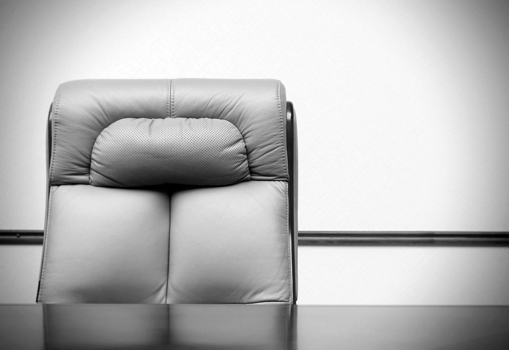 Person setting up ergonomic office chair