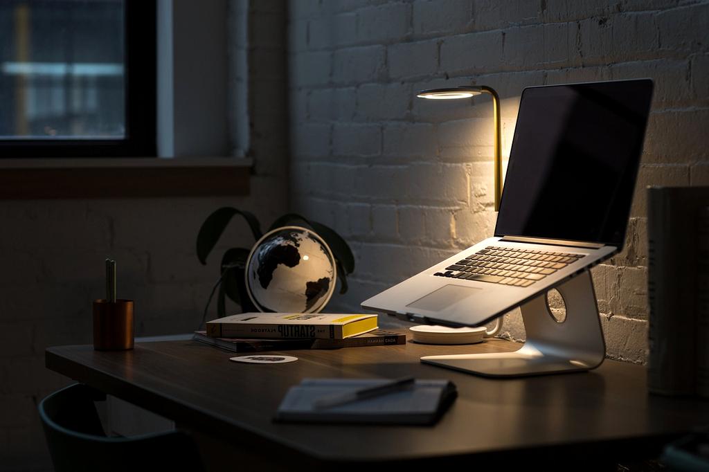 Person practicing proper lighting in workspace